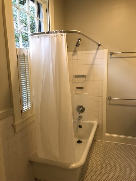 Bathtub-shower and natural light from window - 18 Avery Dr NE