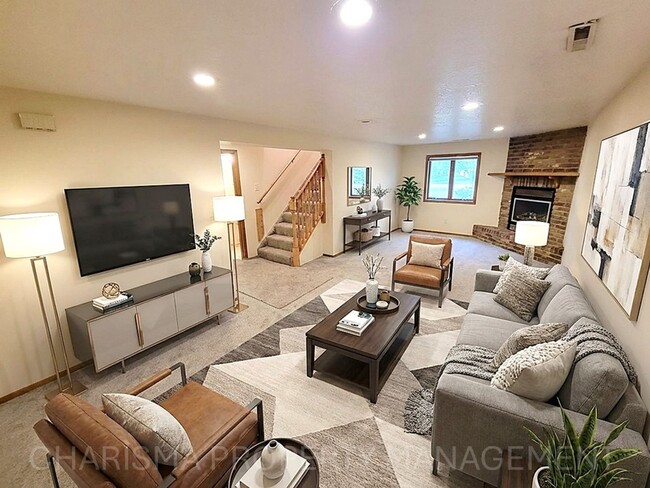 Building Photo - 4 BD, 2 BA - FENCED IN YARD, PRIVATE TRAILS, FINISHED UPPER AND LOWER LIVING AREAS, ATTACHED GARAGE!