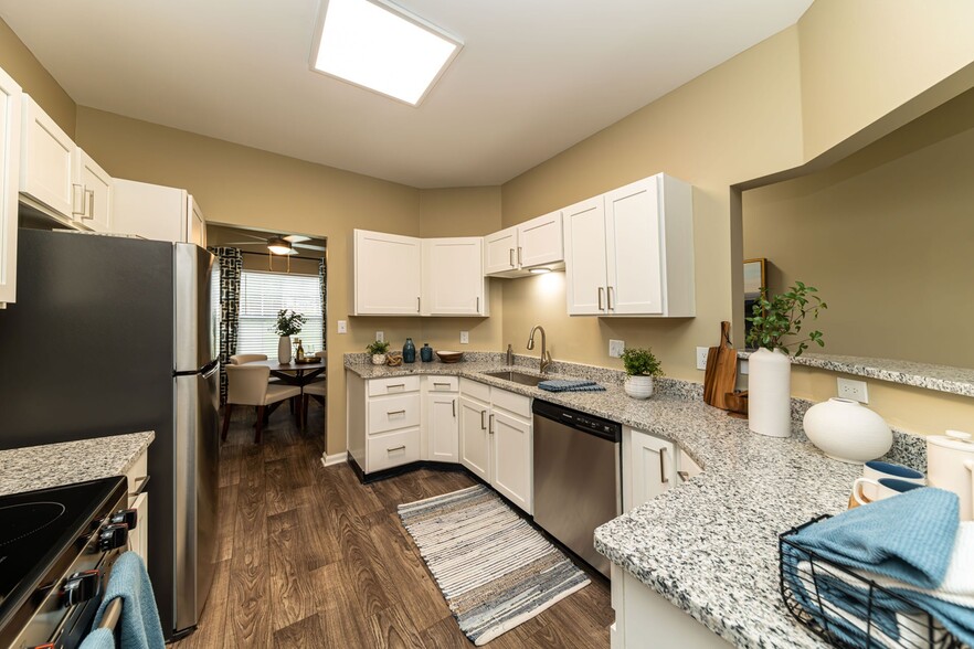 Kitchen with granite counters and modern cabinetry - Cooper Creek