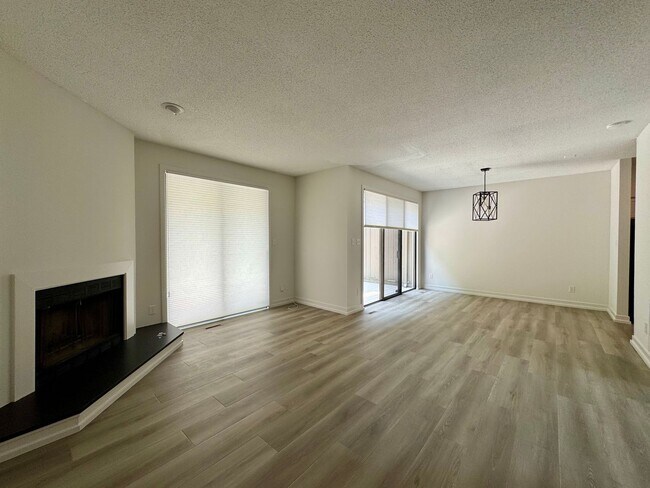 Building Photo - Spacious 2-Story Falconbridge Condo with Private Courtyard and Resort-Style Amenities