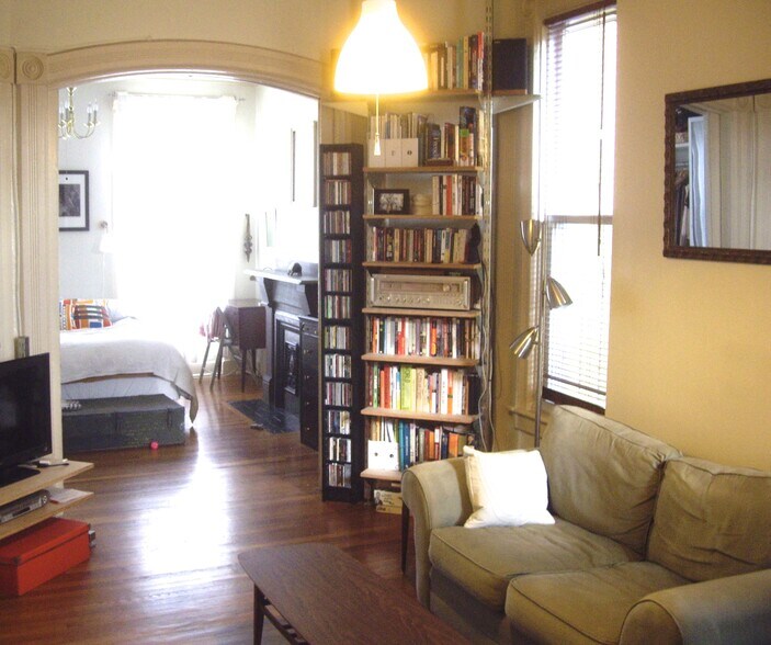 Living room looking into bedroom (pocket doors fully opened) - 22 Lyon St