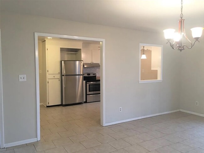 view from dining into kitchen - 407 Collins Ave