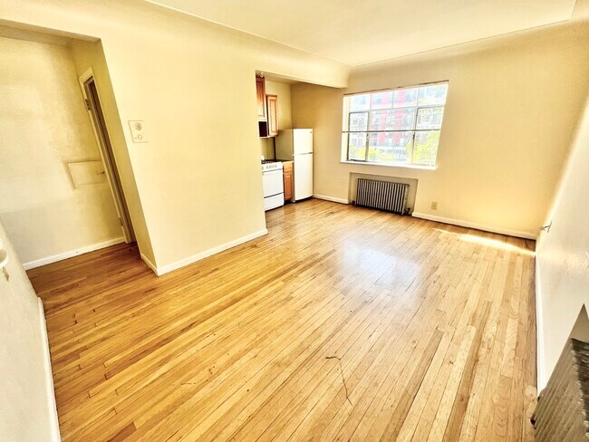 Explore the potential of this sunlit kitchen area, perfect for modern living. - Hillside Apartments