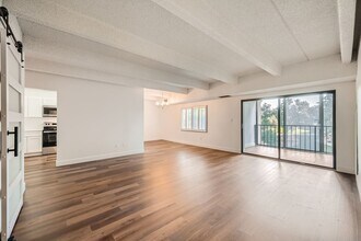 Building Photo - Completely Updated 2 Bedroom 2 Bathroom Condo Available NOW! Garage Parking Included!