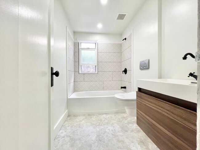 downstairs full bathroom off bottom bedroom - 1390 Dwight Way