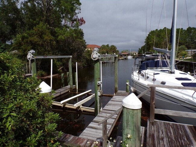 Building Photo - Live the Gulf Breeze Waterfront Life – Dock, Canal Access & Boat Lift!