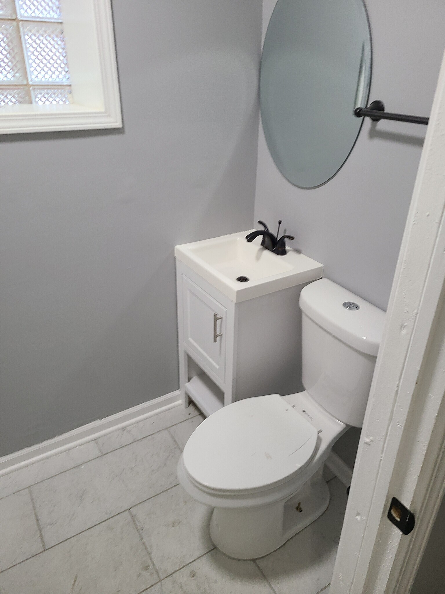 bathroom sink and toilet - 6418 S Eberhart Ave