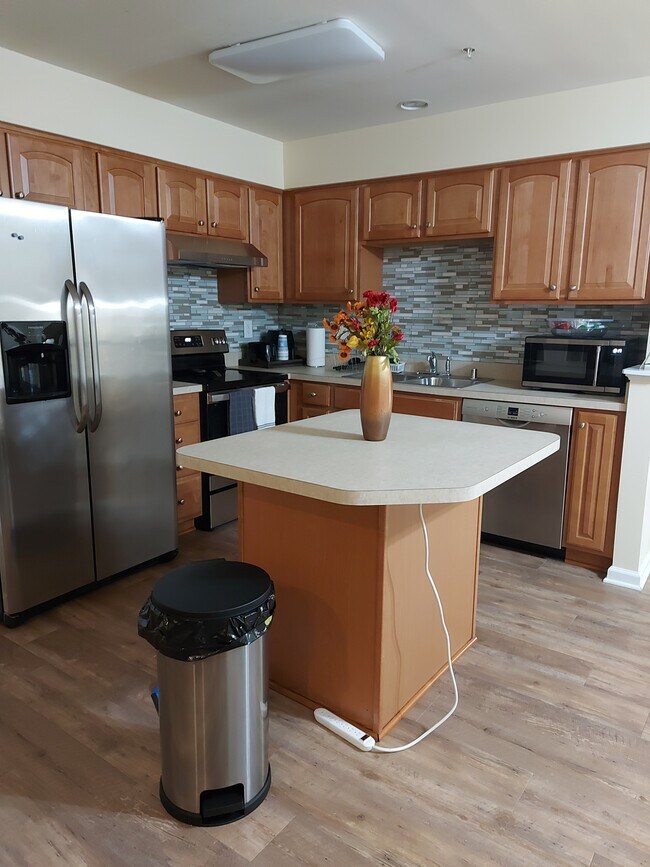 Full kitchen with appliance, utensils and cooking pots and pans - 7021 Holly Springs Ln