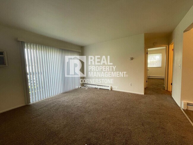 Building Photo - Bright 2-Bedroom with Private Deck & Heat ...