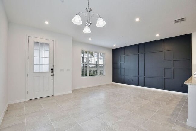 Building Photo - Luxurious 3/2.5 Modern Townhome with a Private Balcony and a 2 Car Garage in the Exclusive Gated ...