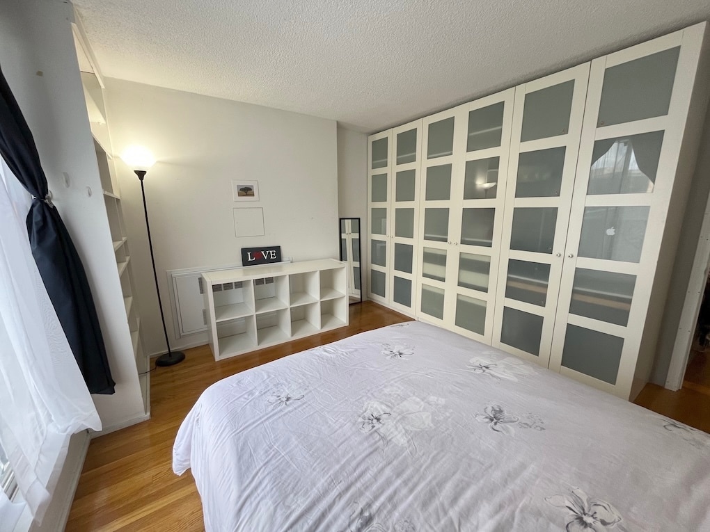 Bedroom 1 w/ ceiling-to-floor wardrobe - 33 Pond Ave