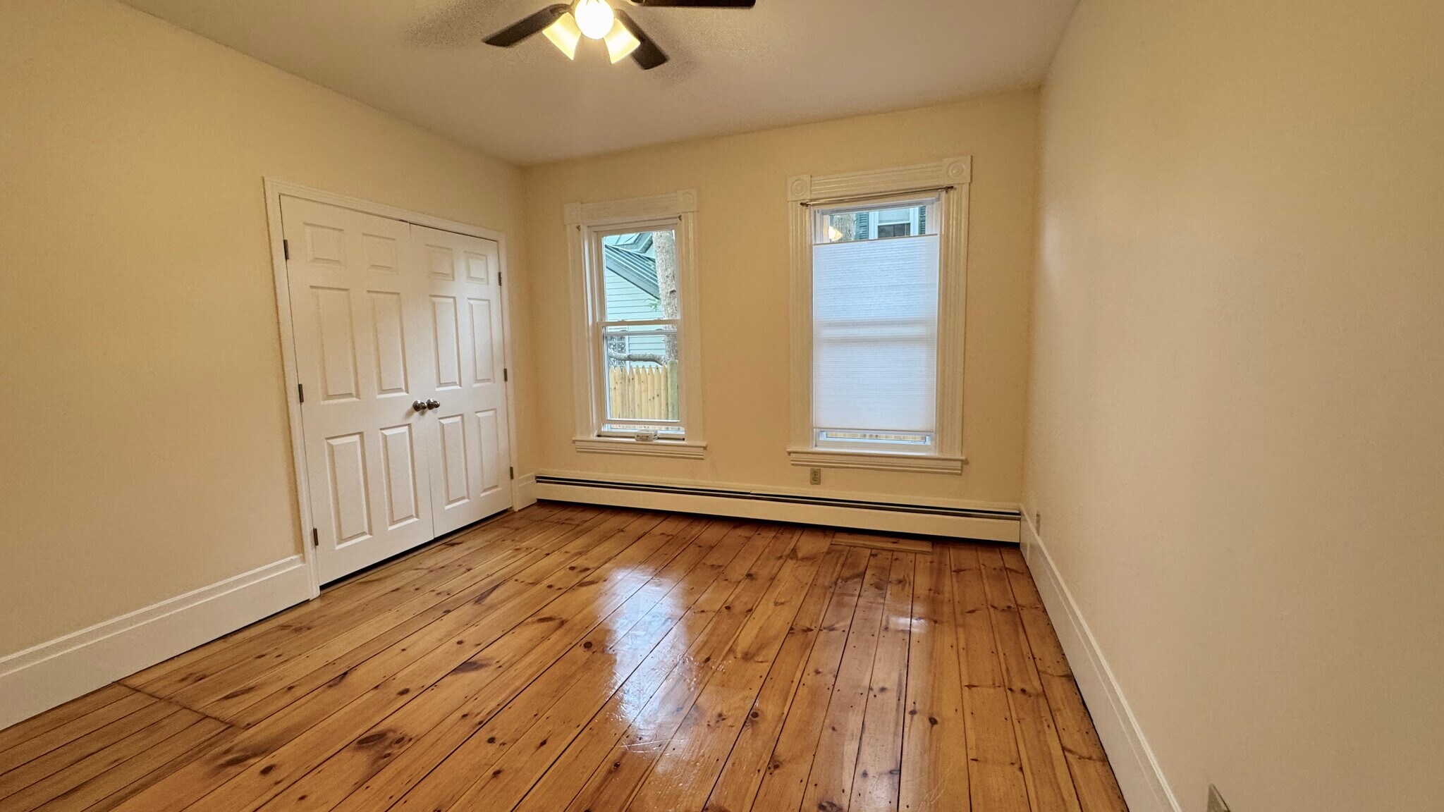 primary bedroom w step in closet, pine floors ceiling fan/light - 21 Liberty St