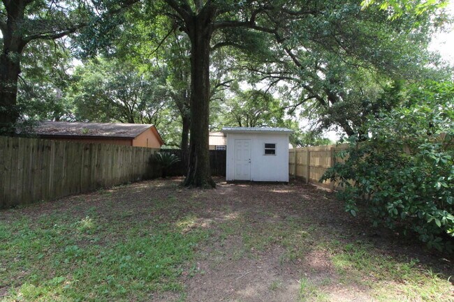Building Photo - 2BR Home with Wood-Look Flooring, Fenced Backyard & Private Patio