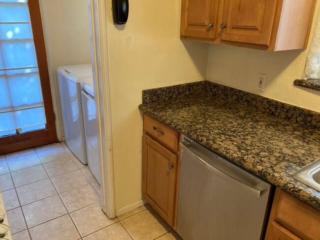 More granite counter space Dishwasher & partial view of laundry room - 4454 Laurelgrove Ave