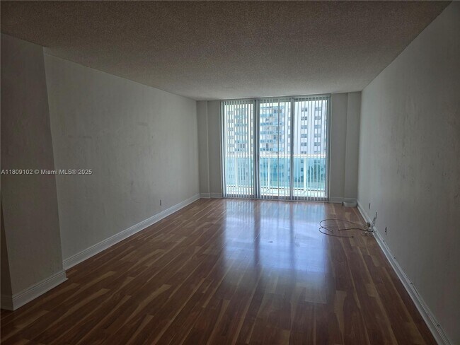 Building Photo - 19380 Collins Ave