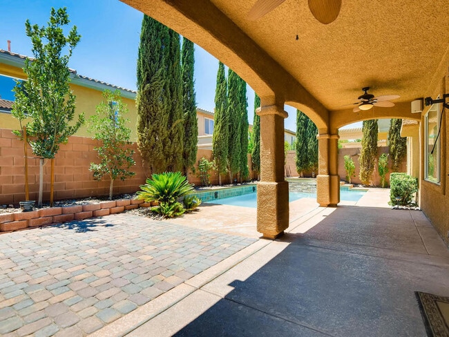 Building Photo - LUXURIOUS UPGRADED HOME IN A GATED SUMMERLIN AREA!!HOUSE HAS POOL AND SPA AND PATIO COVERED BACKY...