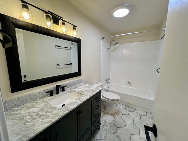 Building Photo - TWO PARKING SPACES INCLUDED! In Unit Washer & Dryer! Large Private Patio for Bikes, Boards and Bb...