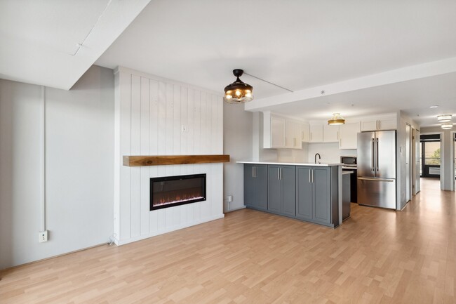 Main living area with fireplace and breakfast bar - 417 E Kiowa St