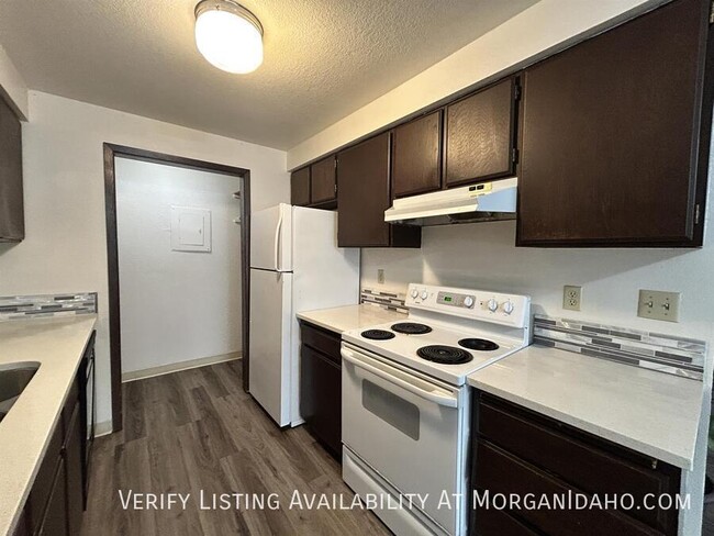 Building Photo - Wood floors, fireplace and updated finishes!