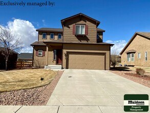 Building Photo - *COMING SOON* 5 Bedroom Home with attached two car garage! Pet Friendly! Widefield