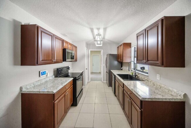 Building Photo - Heated Pool. Premium Upgrades. Fully Renov...