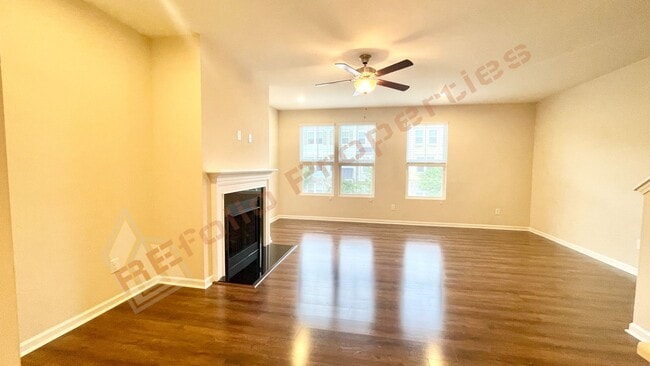 Building Photo - 3 Story Townhome 3 Bedrooms Rear Entry 2 Car Attached Garage with 1st Floor Bedroom, Community Po...