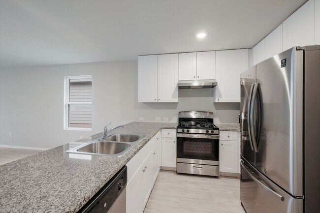 Building Photo - Open-Concept Living with New Flooring