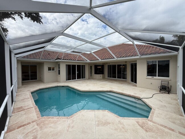 Building Photo - Luxurious 4 Bedroom 3 Bath Lakefront Pool Home W/3-Car Garage