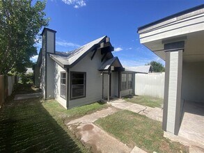 Building Photo - Large 2/2 duplex with a 2 car carport