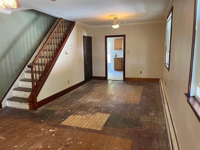 Sunny living and dining room with new flooring throughout - 136 N Green St