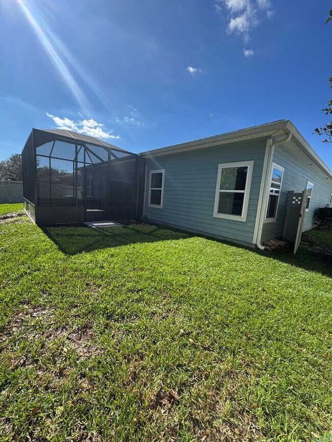 Building Photo - COMING SOON! Beautiful 4BR 3BA Home w/ Screened Lanai & Pond View • Garage Parking • Fenced Yard ...