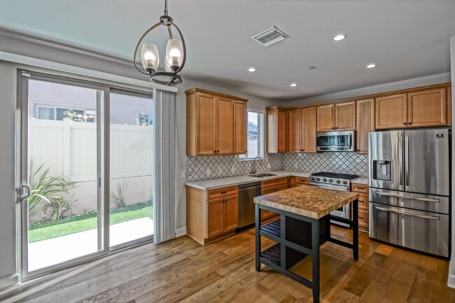 Building Photo - BUILT IN 2019: SPACIOUS & BRIGHT, DETACHED TOWNHOUSE W/ 2-CAR GARAGE & FENCED YARD IN GREAT RESID...