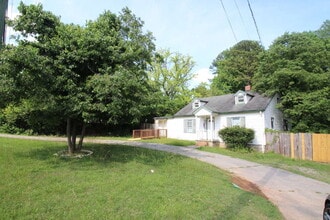 Building Photo - Updated Multi-Bedroom Home | Brand-New Deck | Circular Drive | Triad Premier Realty