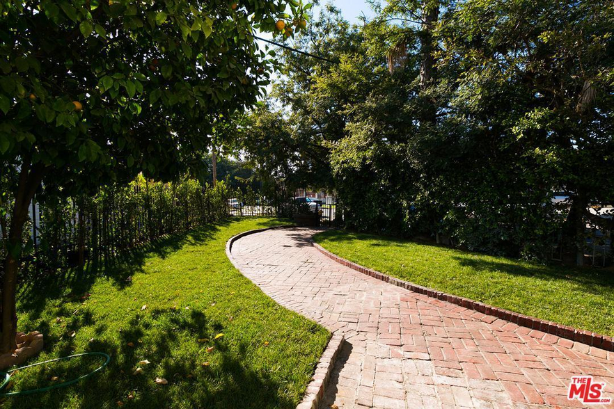 Brick-lined walkway to entrance - 130 S Hoover St