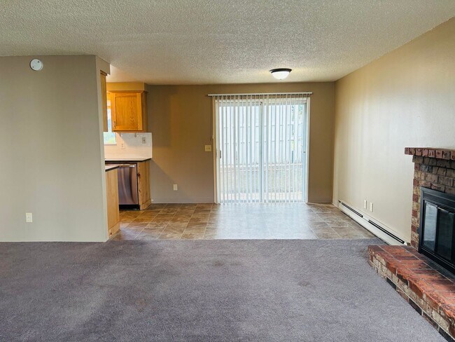 Building Photo - Bright 2 BR Carter Park Living with Fireplace, Carport, and Tons of Storage!