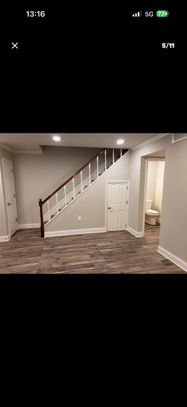 Living area with storage under stairs - 218 Terry Pky