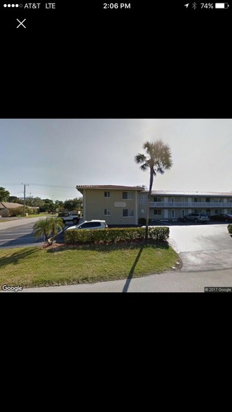 Outdoor parking area and building - 2020 NE 56th St