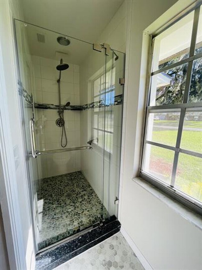 Building Photo - Eustis Lake Front Home with 2 Primary Bedr...