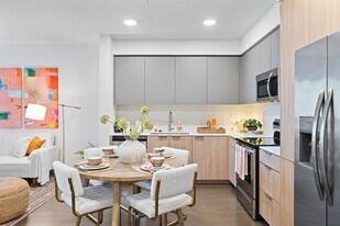 Cook, dine, and unwind in this beautifully designed modern kitchen and dining space, where style meets everyday functionality. - The Grant