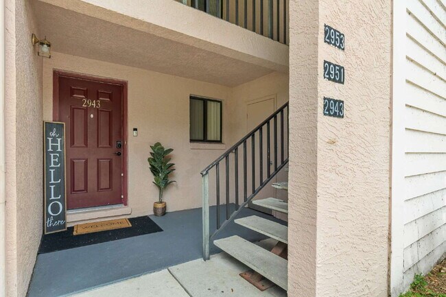 Building Photo - Freshly Updated 2BR Condo with Private Balcony, Community Pool, & In-Unit Laundry