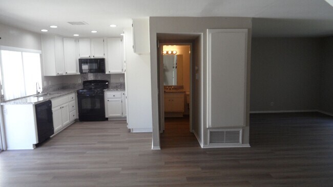 Building Photo - Two Story 4 BR 2.5 BA Condo With 2 Car Garage