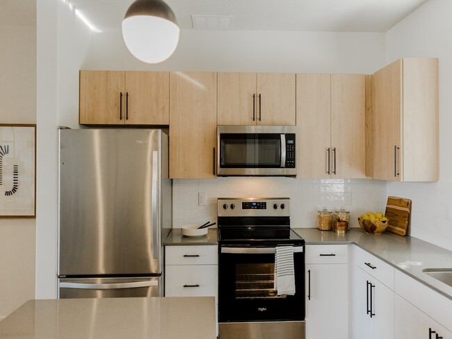 Gourmet Kitchen with Modern Appliances - Parc at Day Dairy Apartments and Townhomes