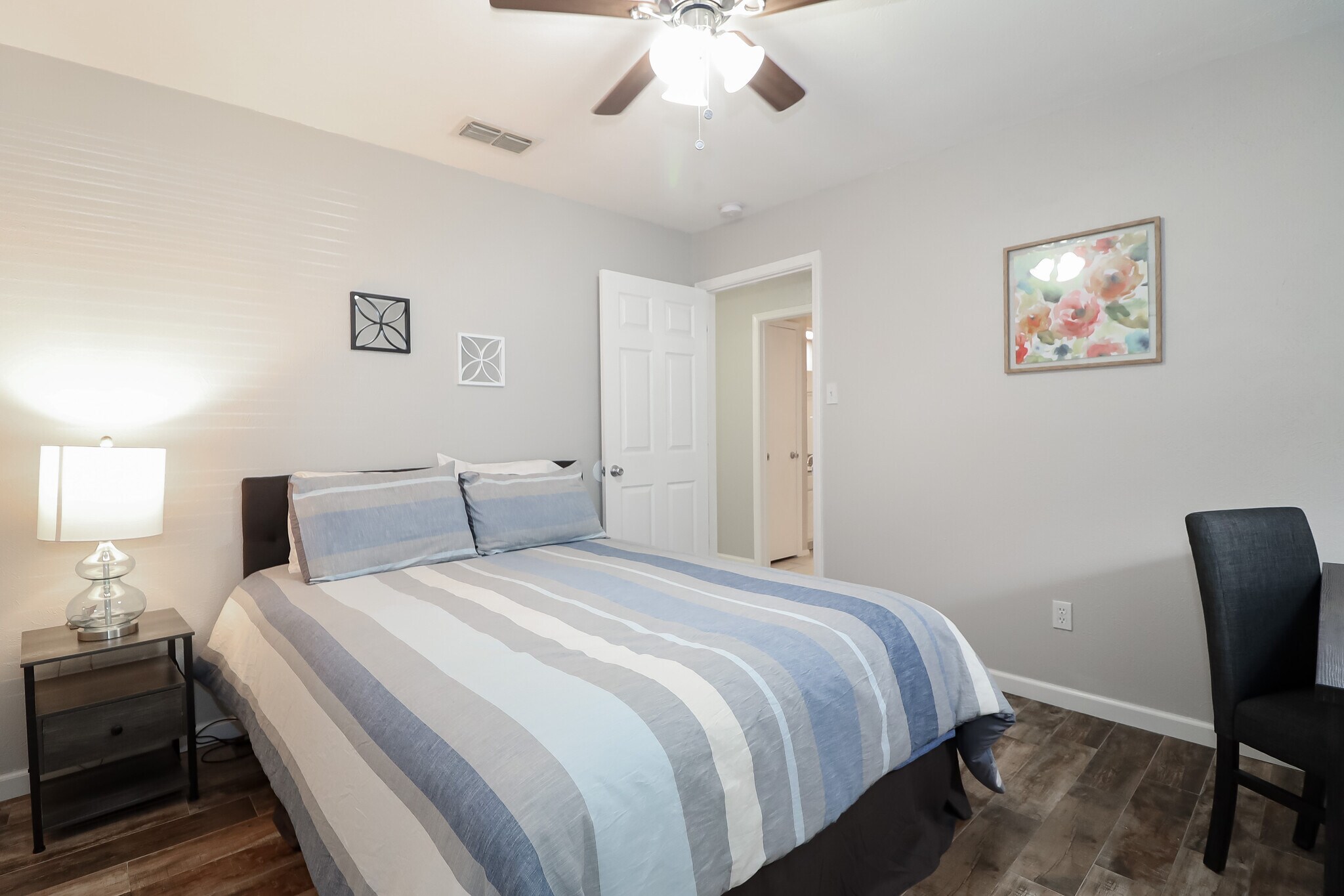 Queen room 1 has a new Simmons Beauty rest mattress with adjustable base. The nightstand has chargin - 2507 Holt Road