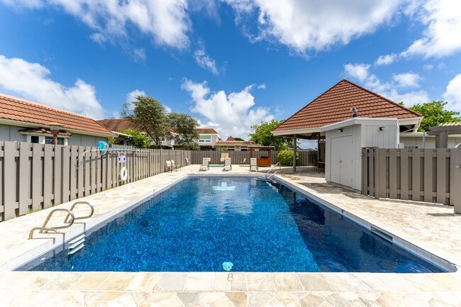 Building Photo - Lakeside, fully furnished, two bedroom, one bath townhome with enclosed garage.