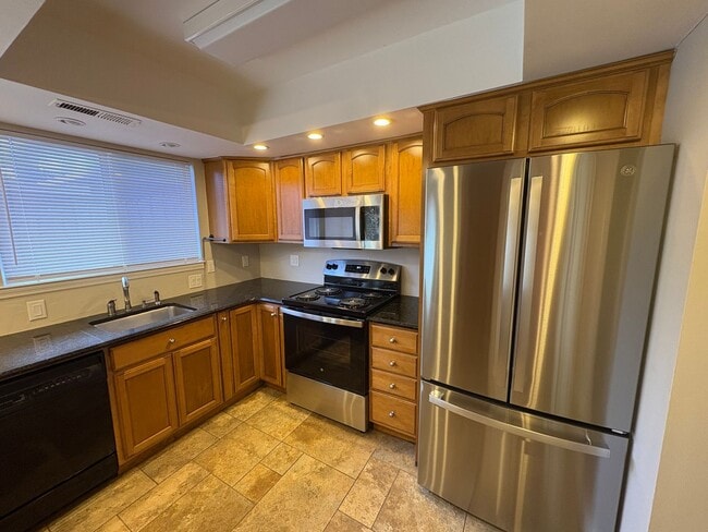 Building Photo - Four Bedroom Townhome Available Now