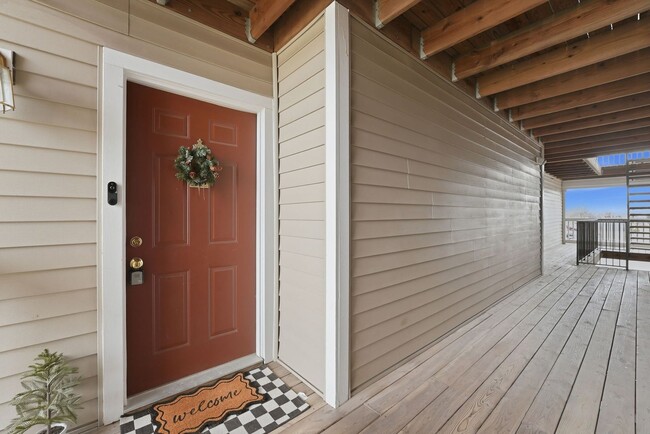 Building Photo - Bathed in natural light, this stunning second level condominium offers an effortless blend of com...