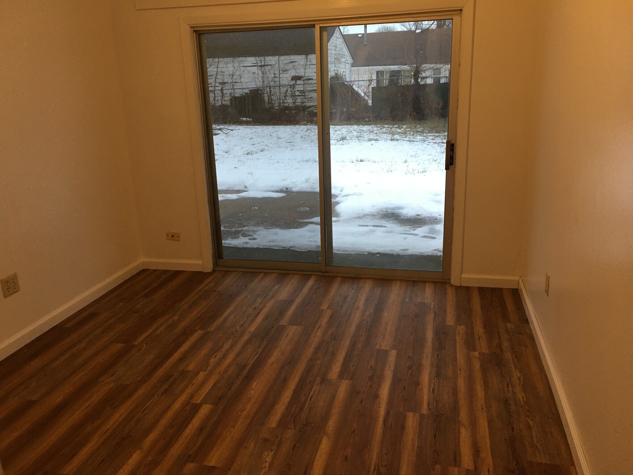 Bedroom 2 Features New Vinyl Plank Flooring with Sliding Glass Doors to a Patio - 4251 Brockley Ave