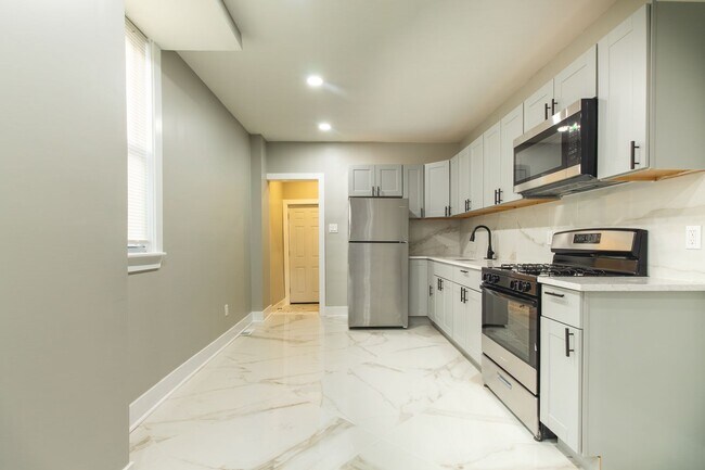 Primary Photo - Spacious 3-Bedroom Single-Family Row Home ...