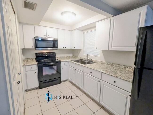 Building Photo - REDUCED!! NEW FLOORS, NEW PAINT INSIDE & O...