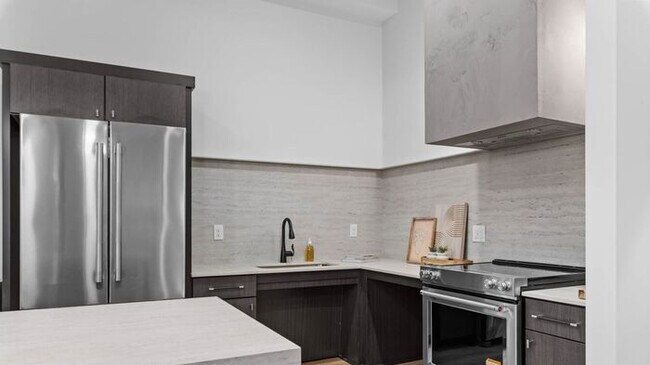 Building Photo - BRAND NEW LUXURY ROW END TOWNHOUSE W 2 CAR GARAGE